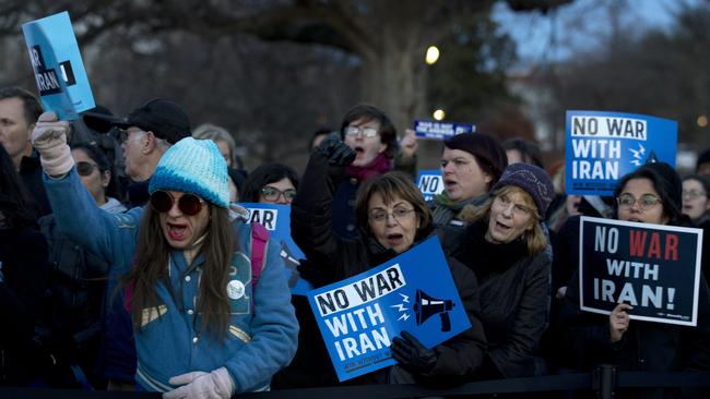 Demonstrators protest outside of the US Capitol, during the House vote. Picture: AP.