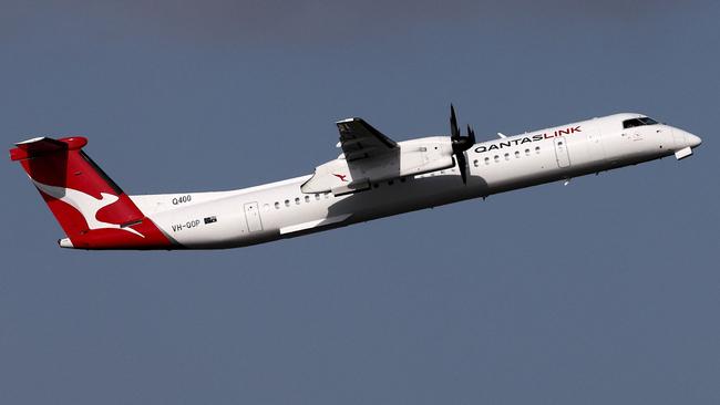 A QantasLink Dash 8-400 takes to the skies over Sydney. Picture: AFP