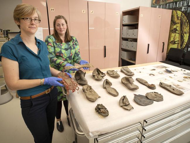 Environment and Sustainability Manager Department of Defence Dr Kate Hibbert and Director of Latitude Heritage Dr Jennifer Jones- Travers with early 19th century artefacts from beneath the floor space of the officers mess at Anglesea Barracks, Hobart. Picture Chris Kidd