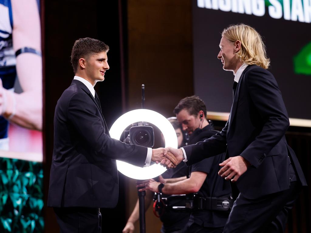 Harry Sheezel shakes hands with Rising Star winner Oliver Dempsey. Picture: Dylan Burns/AFL Photos via Getty Images