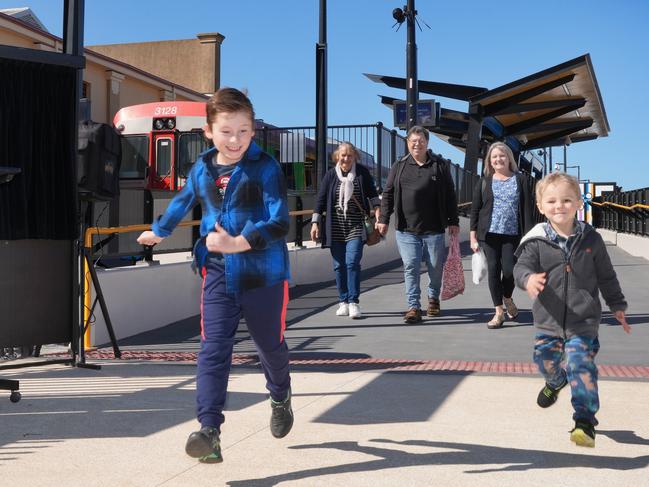 The new Port Dock station is now open, and  Stanley,4, and family friend Jacob Webb,10, with former freight train driver, Bruce Domagalski, 72, of Parafield Gardens, wife Theresa and friend Elizabeth Webb of Valley View, there for the celebration. 24 August 2024. Picture: Dean Martin