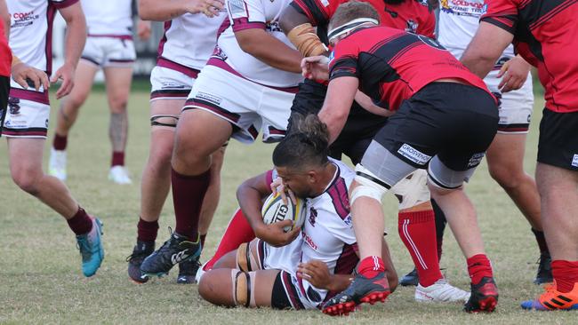 Opening round of the GCDRU. Griffith Uni College Knights v Nerang Bulls. Jaye Paton attacks Tyran Isaac on the ground. Pic Mike Batterham