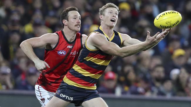 Adelaide’s Alex Keath marks in front of Essendon’s Mitch Brown. Picture: Sarah Reed