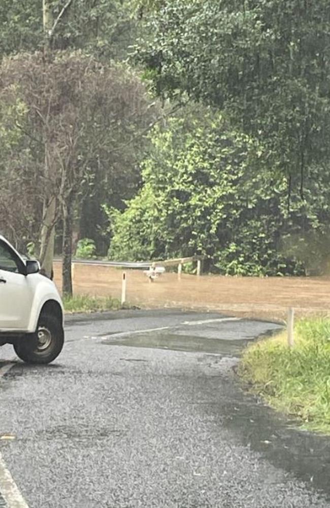 Commissioners Flat Rd at Peachester has been cut by floodwater. Picture: Christine Schindler