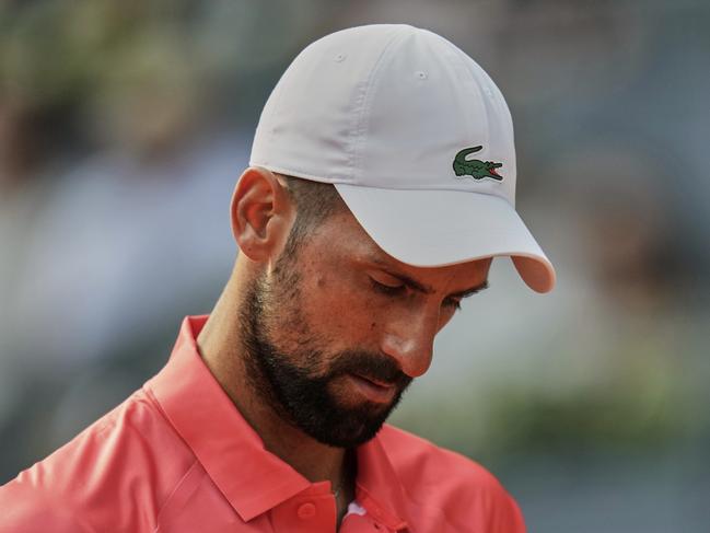 Novak Djokovic of Serbia reacts during his match against Matteo Arnaldi of Italy during the Madrid Open tennis tournament in Madrid, Spain, Saturday, April 26, 2025. (AP Photo/Manu Fernandez)
