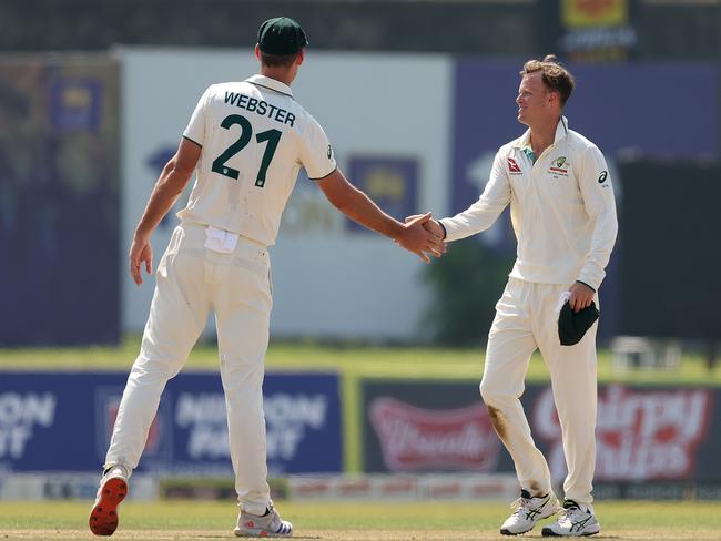 Matthew Kuhnemann and Beau Webster of Australia celebrate after combining to take the wicket of Lahiru Kumara. Picture: Getty Images