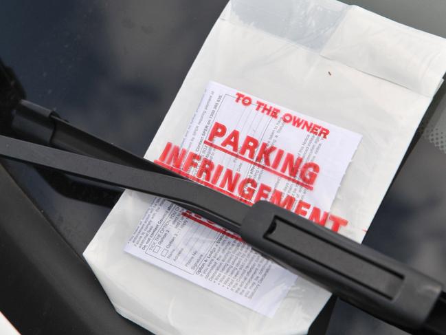 Paul Constantine is annoyed that council parking officers have been issuing parking fines around the Fisherman's Road Markets on a Sunday morning on the corner of Fisherman's Road and Bradman Avenue, where he says signage is inadequate. A council officer issues a fine to a car in another no parking zone on Fisherman's Road.Photo: Brett Wortman / Sunshine Coast Daily