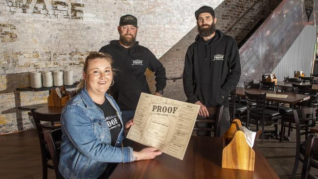 Proof in Duggan St about to open. (Back from left) Ryan Lane and Luke Pitman with Stephanie Edmondson in the foreground. Picture: Nev Madsen.