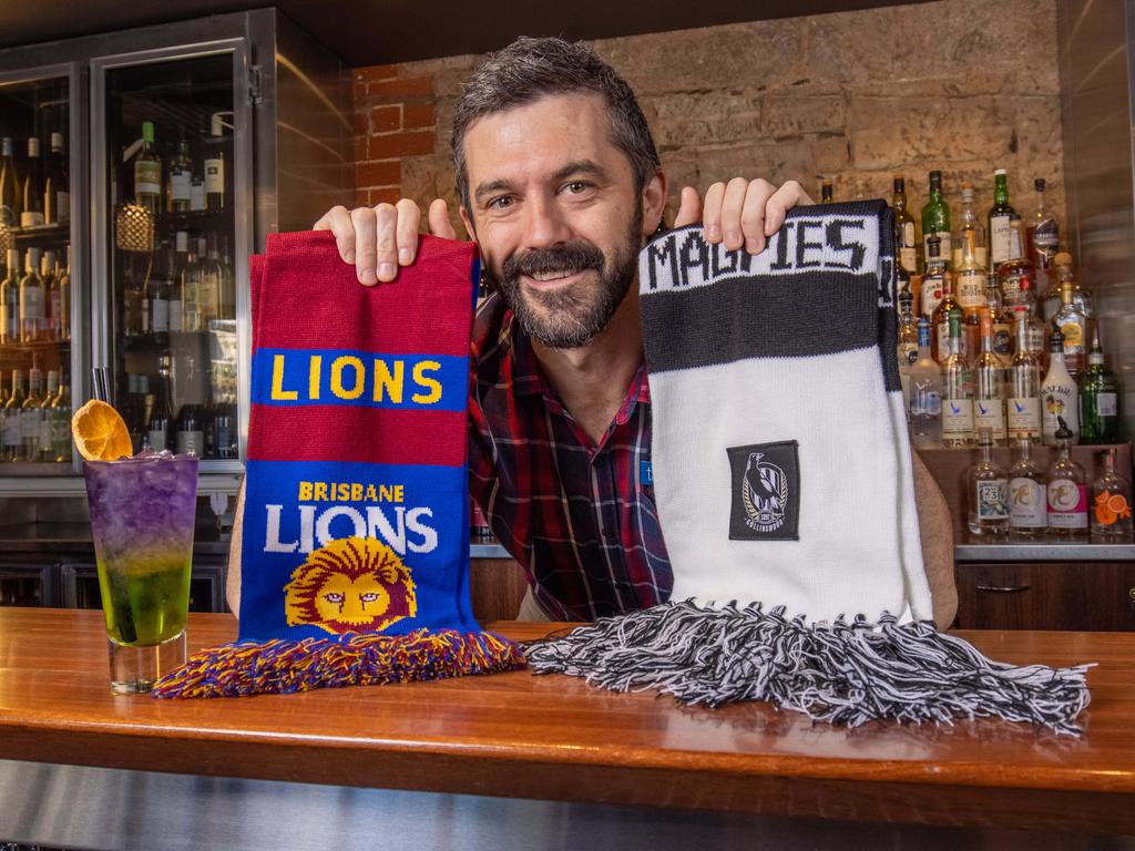 Torrens Arms Hotel Manager Jake Deslandes sporting Brisbane Lions and Collingwood scarves ahead of Grand Final Day 2023. Picture: Ben Clark