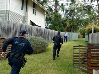 DAILY TELEGRAPH. Embed with police on Operation Amarok regional domestic violence response on the NSW Mid North Coast. In this picture, police from OSG Utah react after noticing a heated argument unfolding next door to an address where they were hoping to arrest a different high risk offender at 32 Leith Street in West Kempsey. Thursday 16/05/2024. Picture by Max Mason-Hubers Multiple units including the high risk DV Coffs Harbour and Newcastle units and the Dog Unit arrived at an address in Kempsey where the mother of the victim of a high profile offender lived to arrest a high profile offender. Although no one was home, police, with the dog unit, circled the property climbing fences to ensure he couldn't escape around the back, setting up a perimeter.