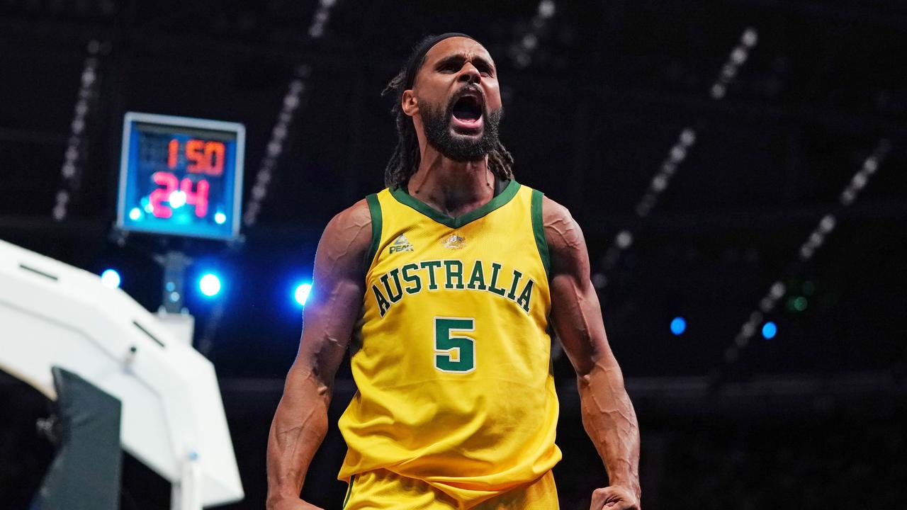 Patty Mills of Australia celebrates after making a basket in the final minutes during match 2 of the Pre-FIBA World Cup series between Australia and the USA at Marvel Stadium in Melbourne, Saturday, August 24, 2019. (AAP Image/Scott Barbour) NO ARCHIVING, EDITORIAL USE ONLY