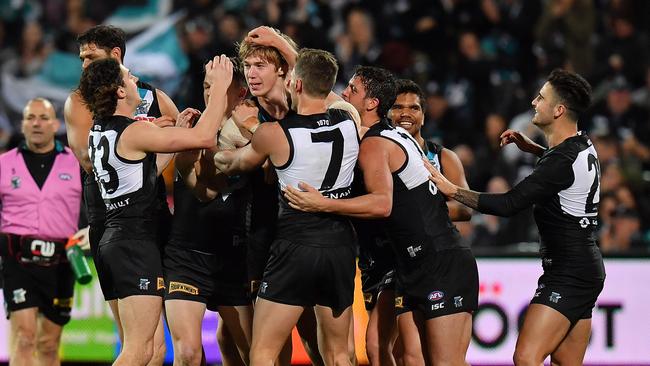 Todd Marshall celebrates with his team mates after kicking his first goal in AFL during the round 23 AFL match between the Port Adelaide Power and the Gold Coast Suns at Adelaide Oval last year. Picture: Daniel Kalisz/Getty Images