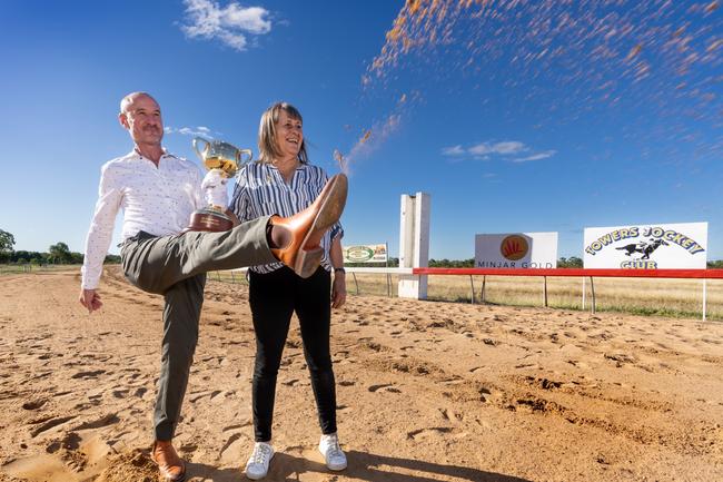 Glen Boss and Shiela Laxon take the Cup to the racetrack at Charters Towers. Picture: Jay Town