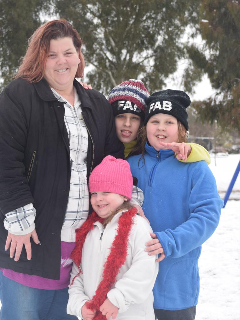 Belinda, Maddy, Jackelyn and Issabella Jordensen have a final play in the snow at Wallangarra. Photo: Alex Nolan / Stanthorpe Border Post