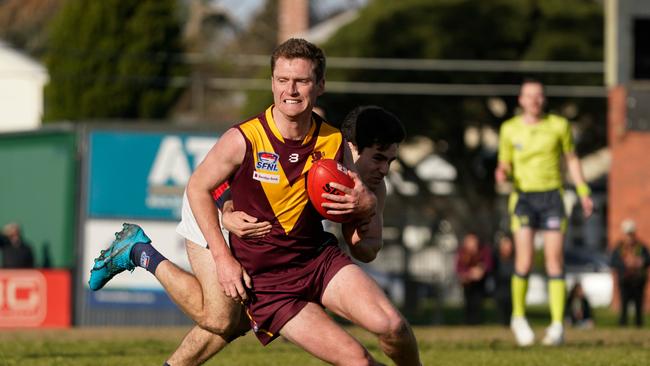 Harrison Lagastes shrugs a tackle. Picture: Valeriu Campan