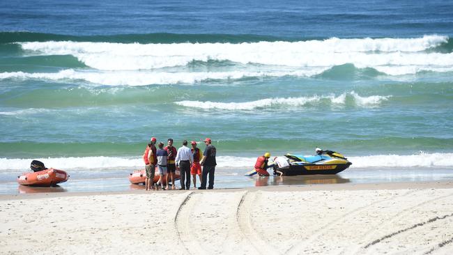 Rescuers at Lighthouse Beach in Ballina after a shark attack. Picture: Marc Stapelberg