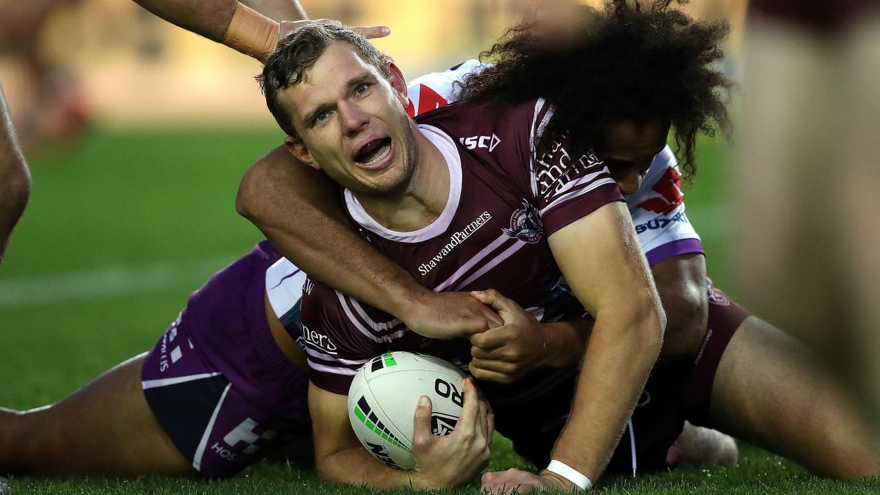 Manly's Tom Trbojevic and Melbourne's Felise Kaufusi at Lottoland.