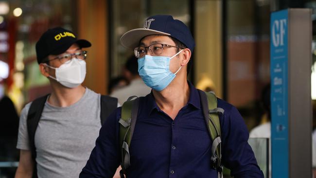 People are seen shopping Sydney’s CBD in January 2022 with face masks. Picture: NCA Newswire / Gaye Gerard