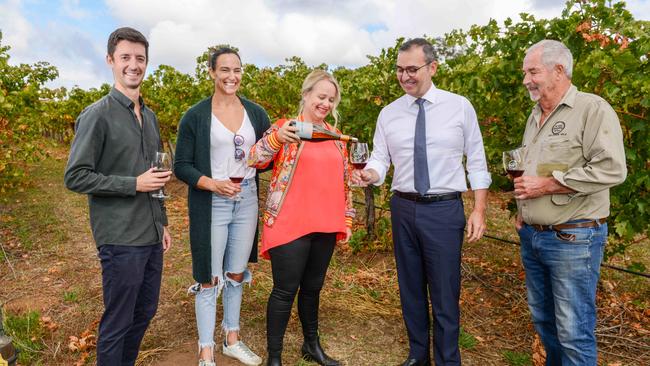 Premier Steven Marshall shares a wine with (L-R) Sam Oliver, Brioni Oliver, winemaker Corrina Wright and Don Oliver at Oliver's Taranga Vineyards in McLaren Vale. Picture: NCA NewsWire / Brenton Edwards