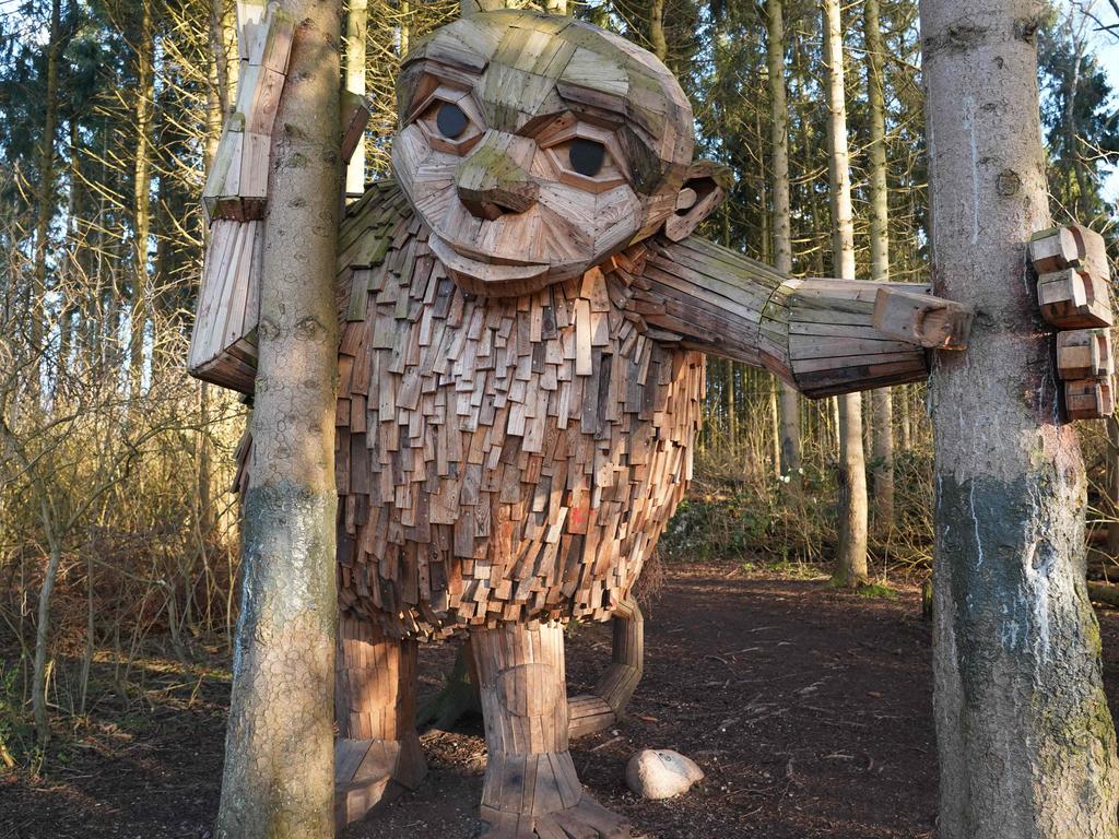 The "troll" statue âLittle Tildeâ by Danish recycling artist Thomas Dambo is pictured in VallensbÃ¦k, Denmark, on March 23, 2023. - Danish recycling artist Thomas Dambo, best-known for his towering wooden âtrollâ sculptures, is sending fans on a complex quest to find his recently-completed hundredth troll, one of his fairytale-inspired creations named âMoon Motherâ. (Photo by James Brooks / AFP)