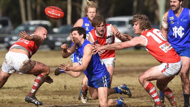 Hastings midfielder Dale Alanis fires out a handball against Sorrento. Picture: Chris Eastman