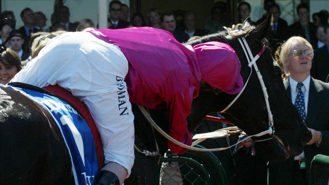 MARCH 8, 2004: Jockey Darren Beadman gives racehorse Lonhro a hug on returning to scale after winning race 6, Australian Cup at Flemington in Melbourne, 08/03/04. Pic Craig Hughes. Turf