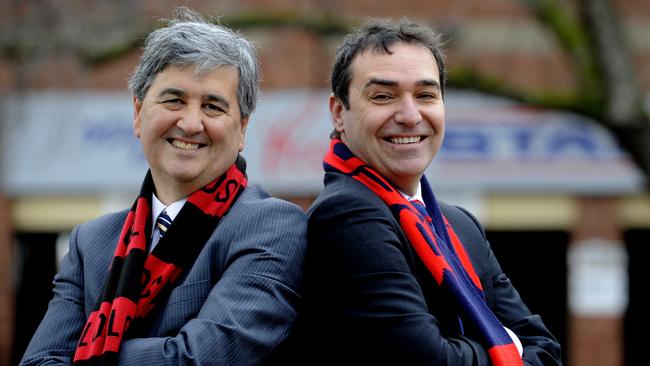 Treasurer Rob Lucas with Premier Steven Marshall in the colours of their favourite SANFL clubs, West Adelaide and Norwood.