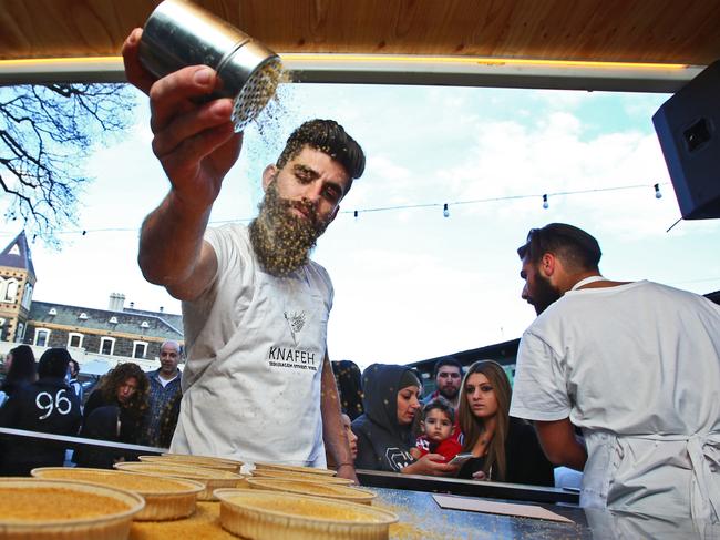 The Knafeh Bakery, which has built a hugely popular following in Sydney, expands to Melbourne and will soon kick off in New York. Joey El-Issa spreads polenta onto some of the cakes before they go into the oven.