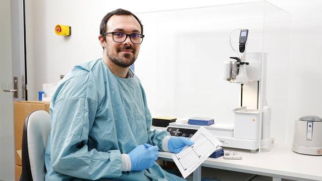 Laboratory Scientist Matt Hadaway monitoring Covid-19 testing plate at Sullivan Nicolaides Pathology, Brisbane. Picture: AAP Image/Josh Woning