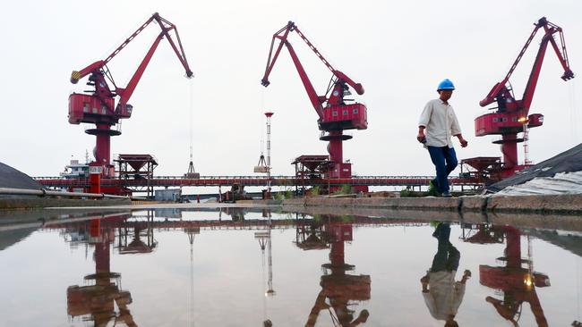 Workers at a Chinese port. Pic: AFP