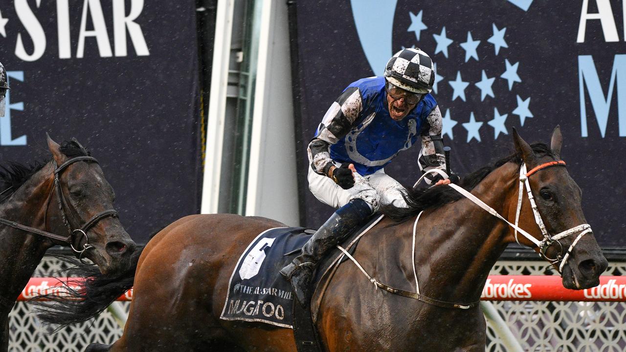 Hugh Bowman riding Mugatoo defeats Damien Oliver riding Russian Camelot. (Photo by Vince Caligiuri/Getty Images)