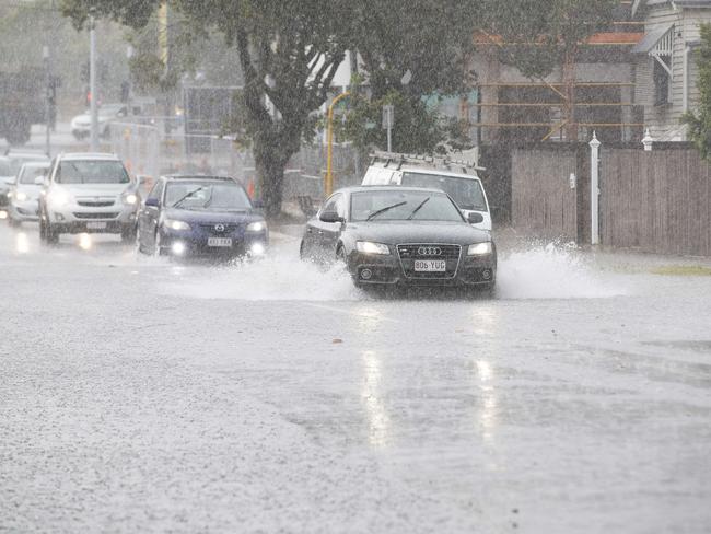 Streets are flooding around Brisbane as storm hits the city on Friday afternoon. Crosby Rd, Hamilton, Brisbane, 13th of December 2019. (AAP Image/Attila Csaszar)