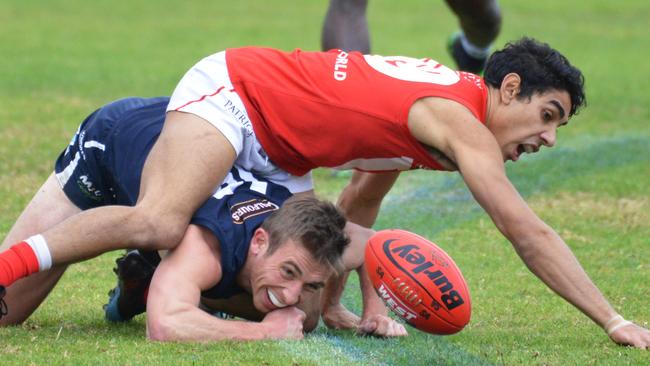 South captain Joel Cross sneaks under Keanu Miller at Noarlunga. Picture: AAP/Brenton Edwards