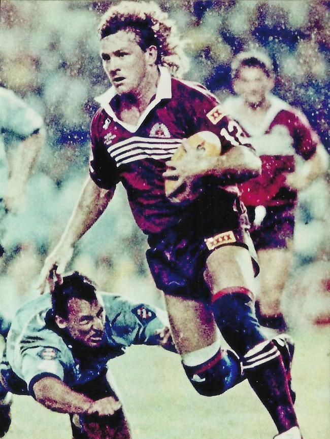 Mike McLean, who appeared at court today to support his son, evades Laurie Daley in the 1991 State of Origin series. Picture: Supplied