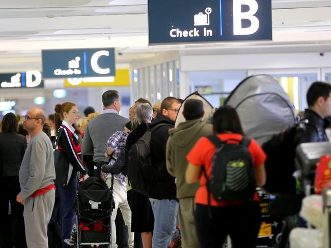 People at the Sydney international Airport during a strike by customs officers could cause some delays in boarding international flights today. Some long cues seen at some check ins but the departures gate was clear .pic John Grainger