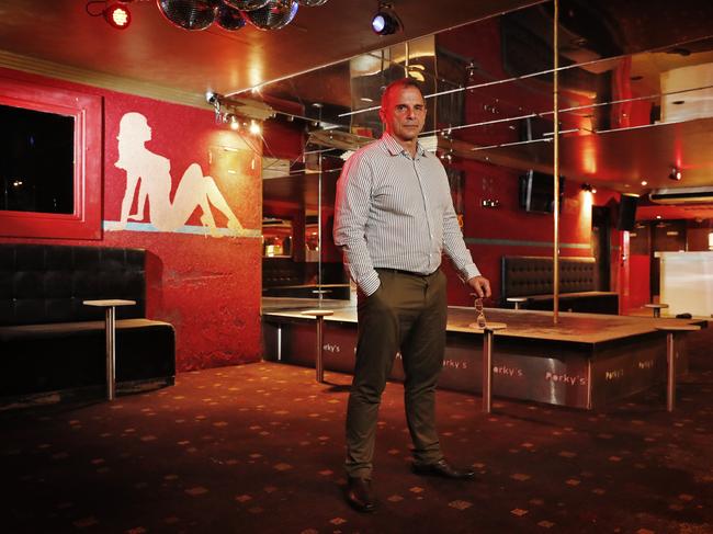 Real estate agent Dominic D'Ettore inside the shuttered Dreamgirls/Porky's strip club. The site is now for lease before it undergoes redevelopment as commercial and retail space. The heritage-listed neon Porky’s signs will stay. Picture: Sam Ruttyn