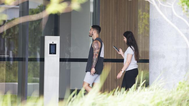 A couple enters the Opal Tower on Monday. Picture: Dylan Robinson