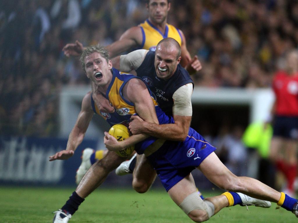 Adam Selwood and Chris Judd in action in Perth in 2008. Picture: Lincoln Baker
