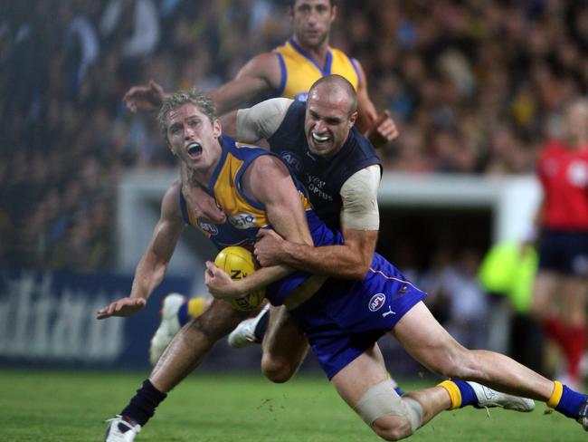 Adam Selwood and Chris Judd in action in Perth in 2008. Picture: Lincoln Baker