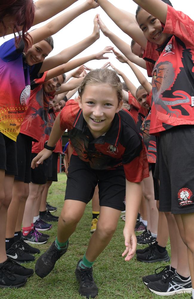 Jesse Davey runs through a tunnel made by year 5 students on his way out of primary school. Picture: (A)manda Parkinson