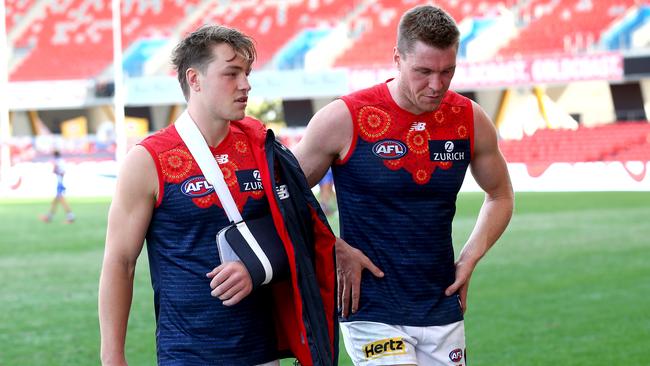 Tom Sparrow (left) broke his collarbone in Saturday’s loss. Picture: Jono Searle/AFL Photos/via Getty Images