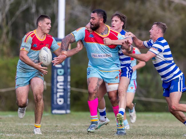 Former NRL star Andrew Fifita offloads for De La Salle Caringbah. Picture: Adam Wrightson