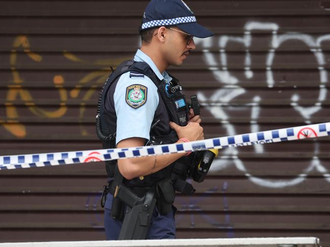 Police cordon off the shop as investigations begin. Picture: Rohan Kelly