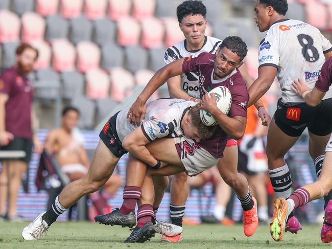 Anton Whaiapu of Burleigh Bears is wrapped up. Photography by Stephen Archer.