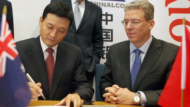 Chinalco Xiao Yaqing signs an agreement with then Rio Tinto CEO Tom Albanese in London in 2019. Picture: Bloomberg