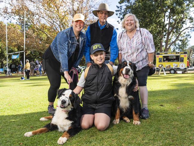 Riley Dewhurst with Bernese mountain dogs Marcello (left) and Mozart and (back, from left) Sarah Dewhurst, Stuart Gibbs and Helen Gibbs at Toowoomba's Million Paws Walk at Queens Park, Friday, May 24, 2024. Picture: Kevin Farmer