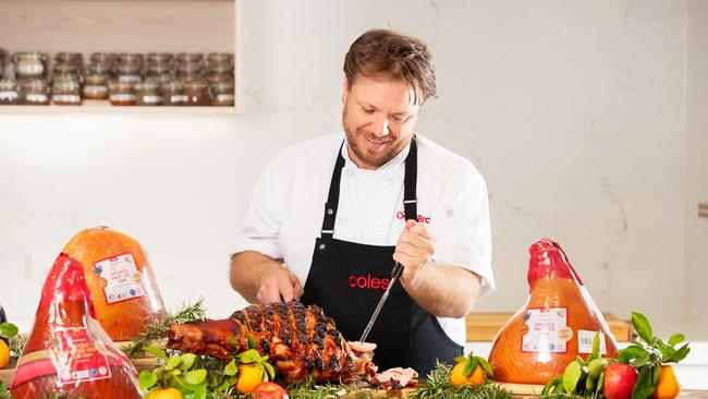 MasterChef star and Coles ambassador Michael Weldon carves up a festive ham. Image: Rebecca Michael