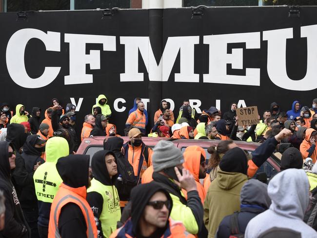 Construction workers gather outside the CFMEU offices in Melbourne. Picture: Andrew Henshaw