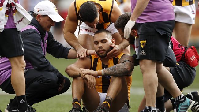 Paul Puopolo attends to Jarman Impey during last year’s clash against Geelong. Puopolo has been dropped from the senior team this year and Impey has returned from his knee reconstruction. Picture: Getty Images