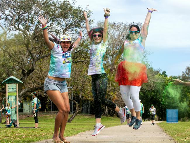 Kiara Rippon from Walkerston, Shannon Wheeler and Grasstree Beach and Dannie Brownsey from Mount Pleasant at the Mackay Colour Run 2021. Picture: Michaela Harlow